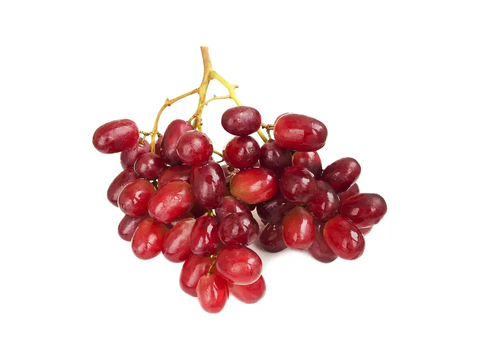 Red seedless grapes, on a white background